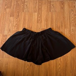 flowy black shorts with a drawstring on the front (has pockets)